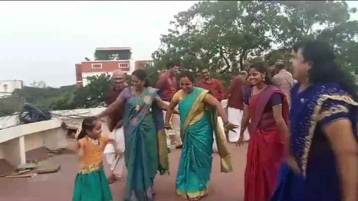 colleagues-in-traditional-attire-outdoors-samarthana