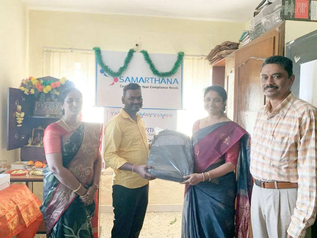 staff-members-presenting-gift-samarthana
