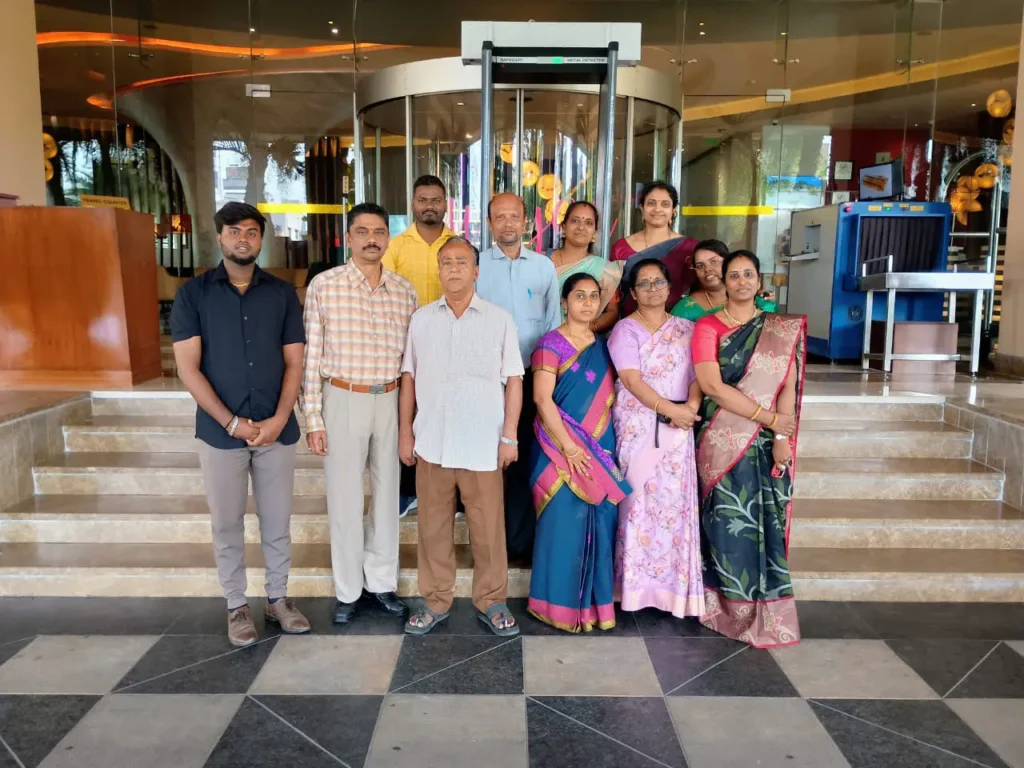employees-standing-at-office-entrance-samarthana