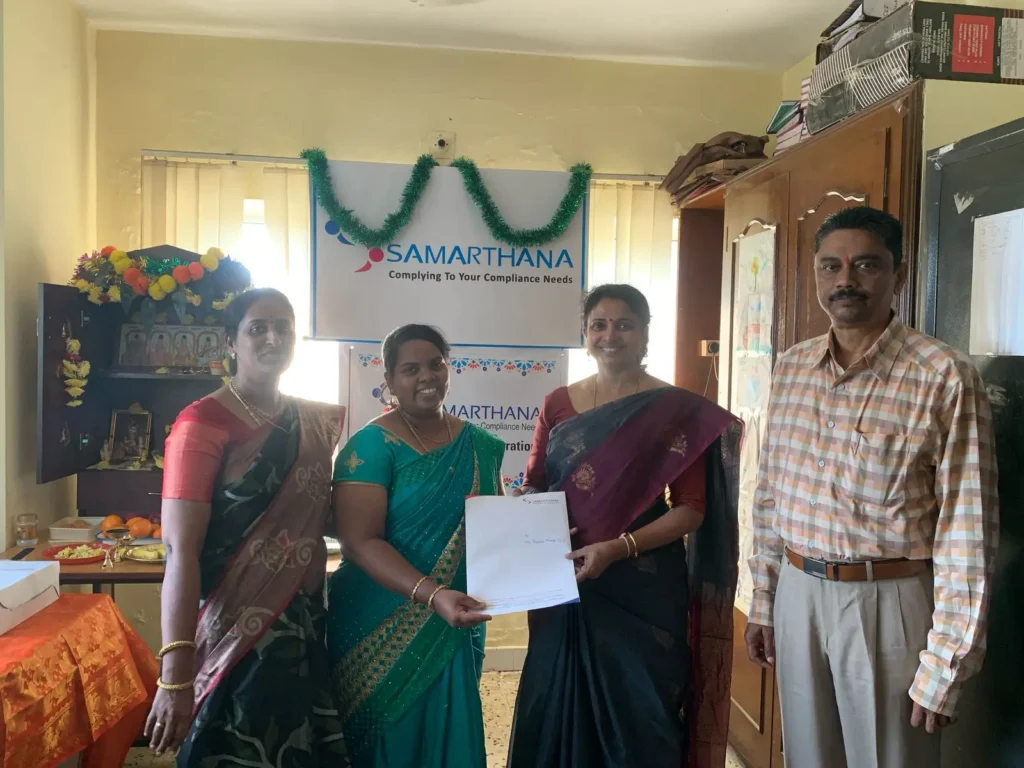 staff-members-receiving-certificates-samarthana