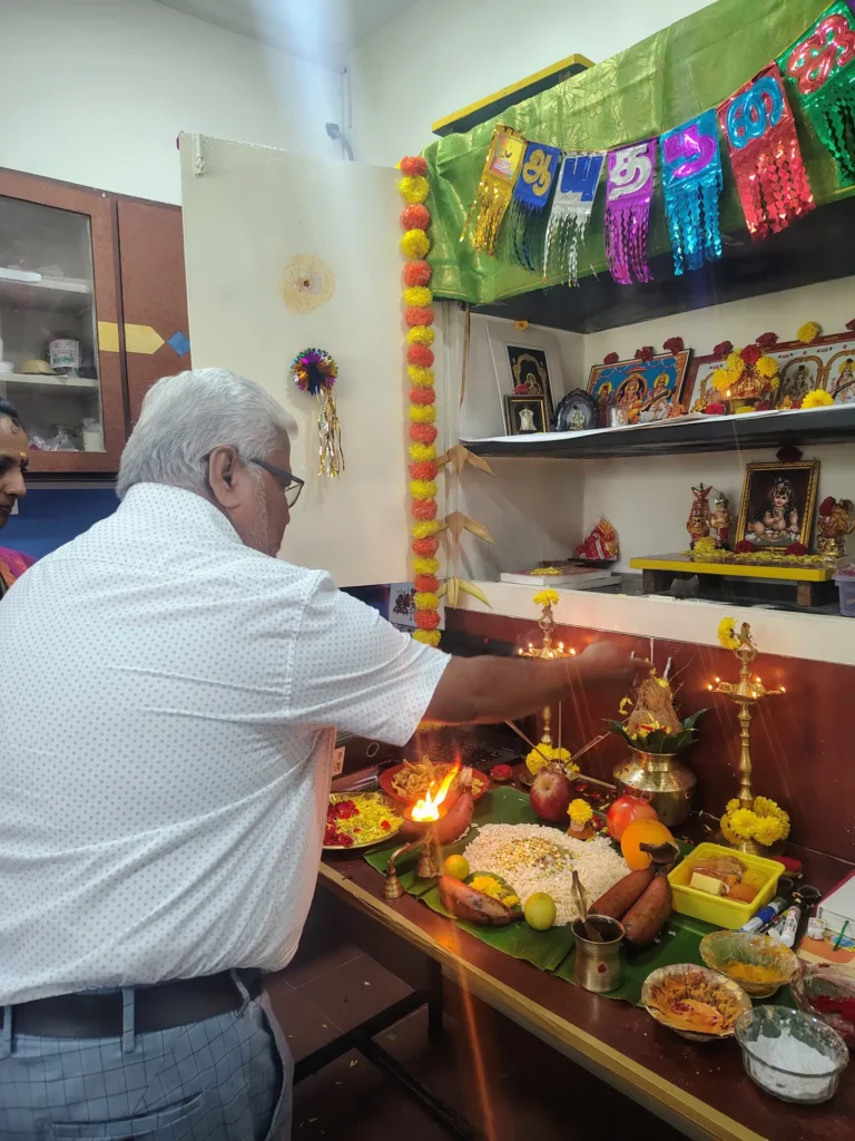 staff-member-performing-office-puja-samarthana