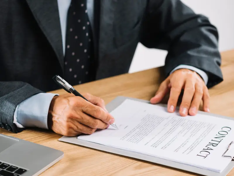 person-signing-employment-contract-samarthana-image