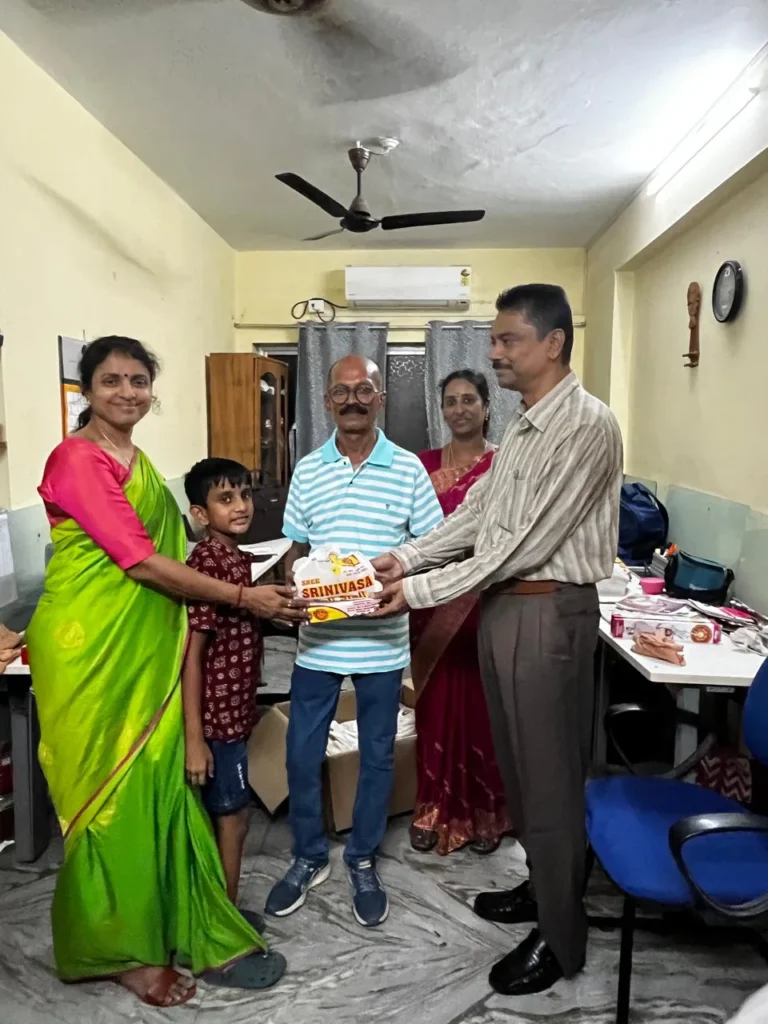 staff-presenting-a-gift-to-colleague-samarthana