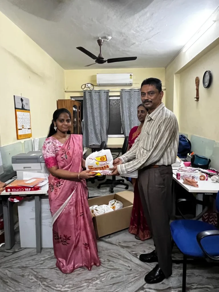 staff-member-presenting-gift-samarthana