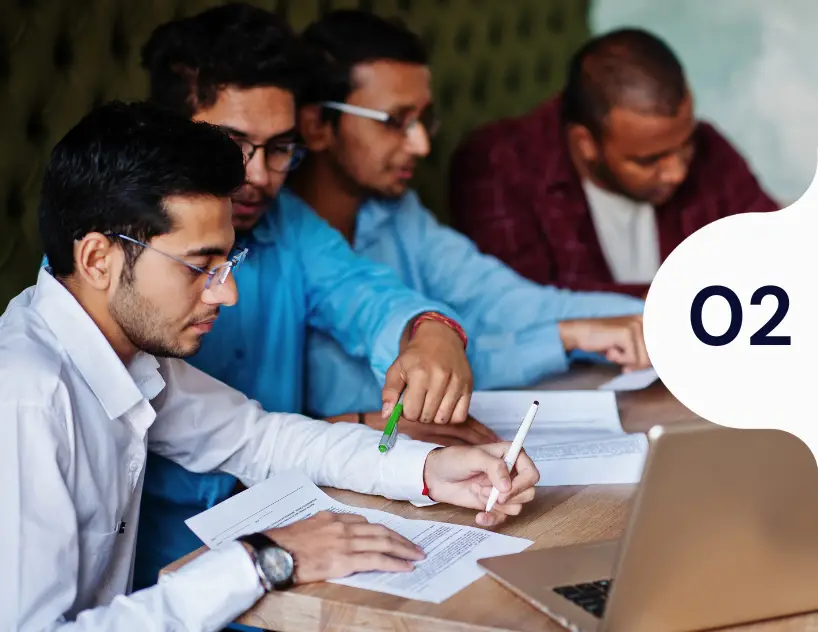 colleagues-reviewing-documents-together-samarthana-image