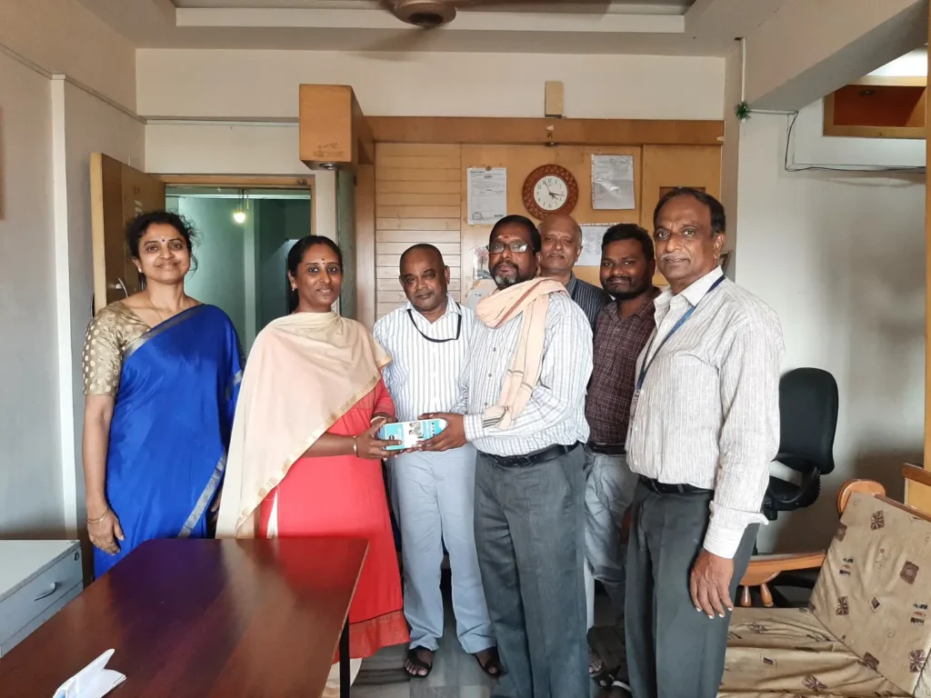 colleagues-standing-together-in-office-room-samarthana
