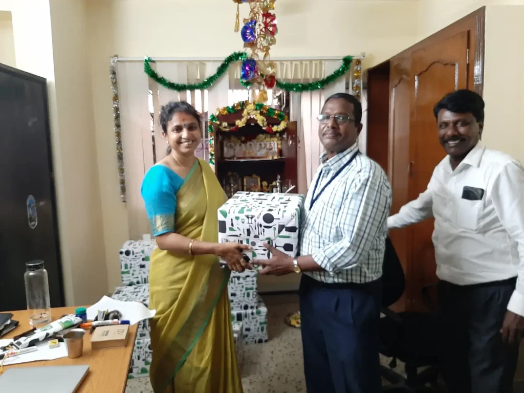 people-presenting-gift-to-colleague-samarthana