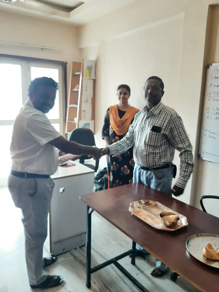 colleagues-discussing-around-office-table-samarthana