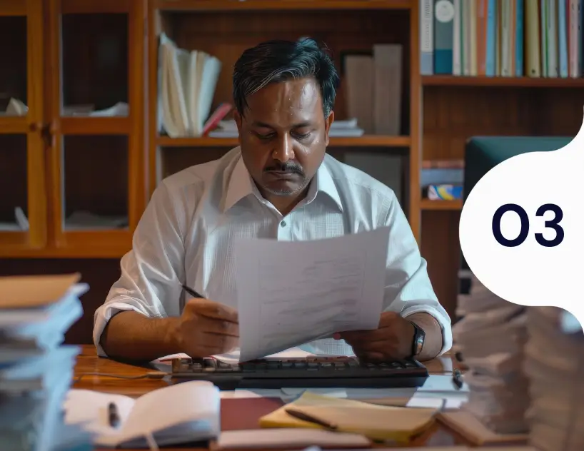 businessman-reviewing-financial-documents-samarthana-image