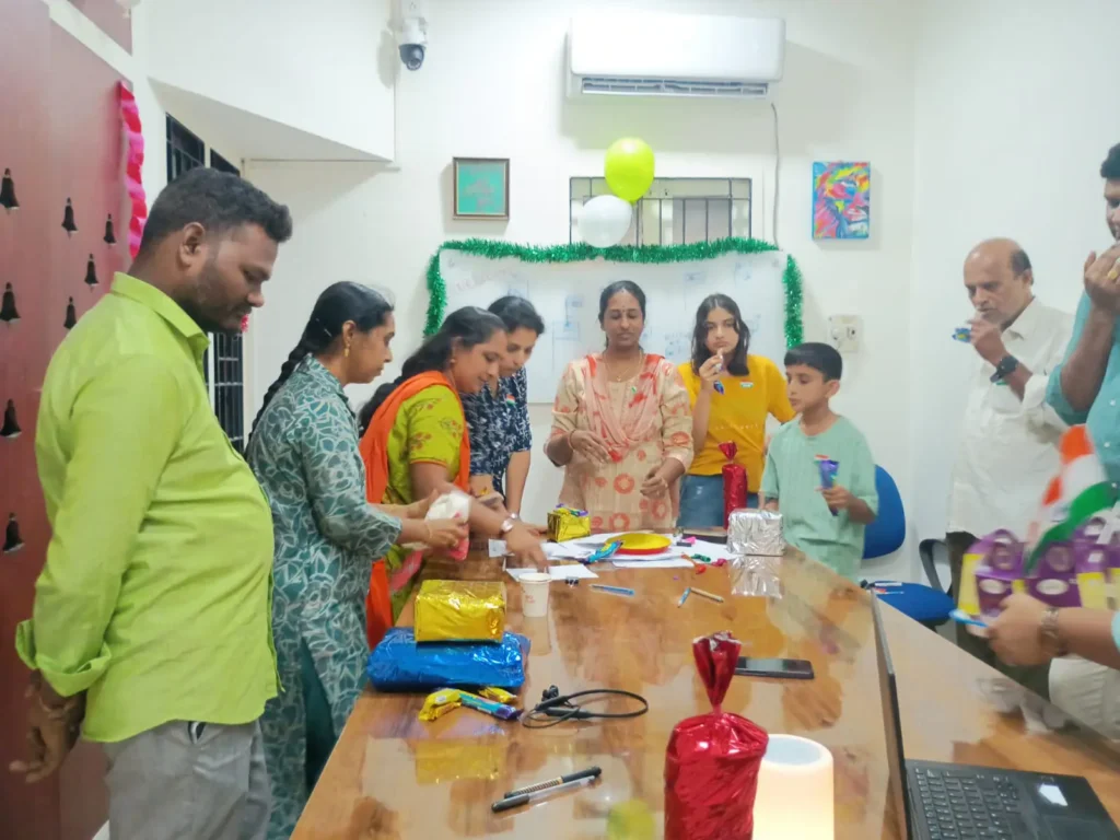 staff-members-sharing-sweets-samarthana