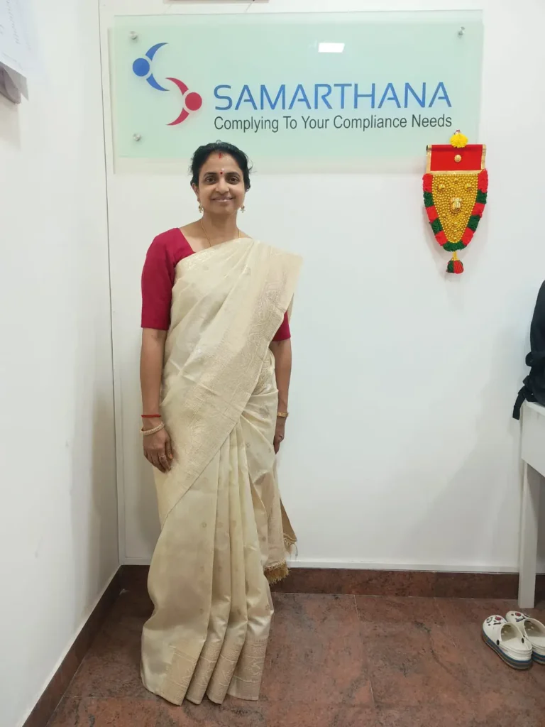 employee-standing-beside-onam-decoration-samarthana
