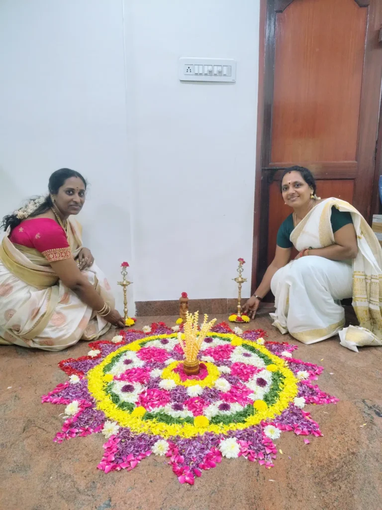 staff-members-posing-beside-pookalam-samarthana